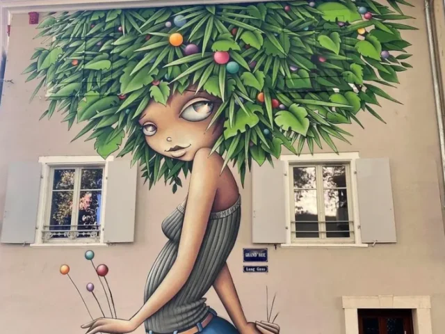 Green-Girl-mural-by-Vinie-Graffiti-in-Mulhouse-France.-2-1010x1200